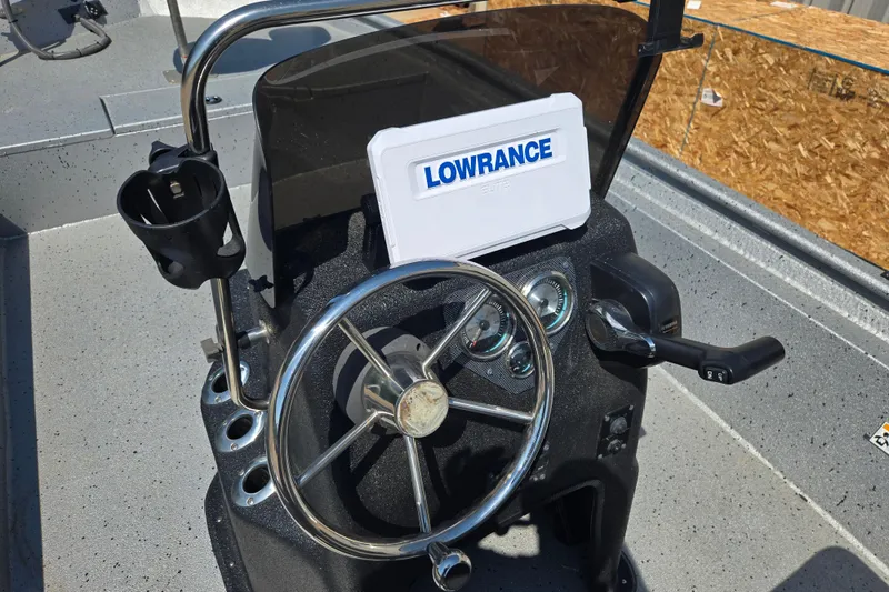 Slide: The Image of 2019 Xpress SW20B boat console with steering wheel and Lowrance device. - 10