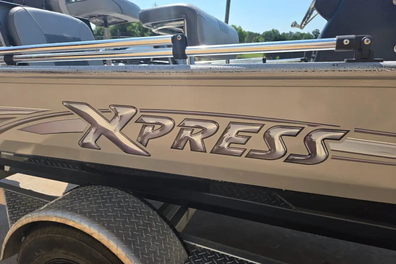 Slide: The Image of 2019 Xpress SW20B boat side view with logo and seating. - 4