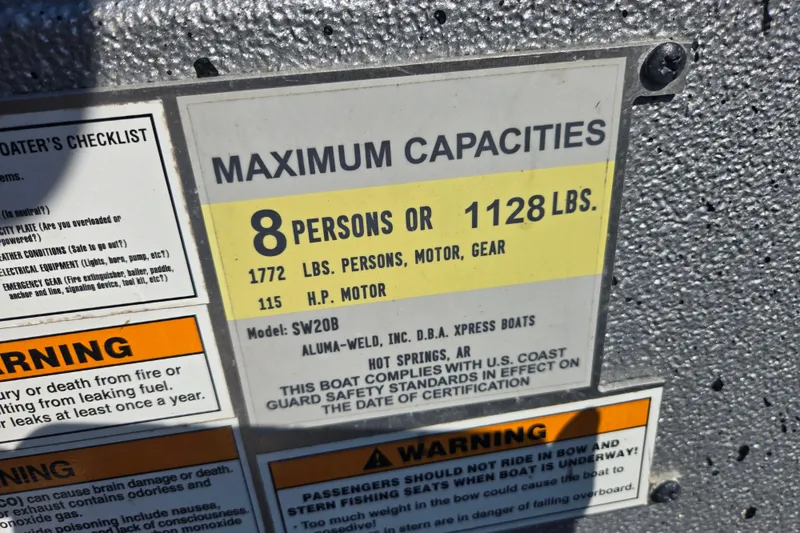 Slide: The Image of Boat capacity label for Xpress SW20B, 2019 model, showing maximum 8 persons or 1128 lbs. - 6