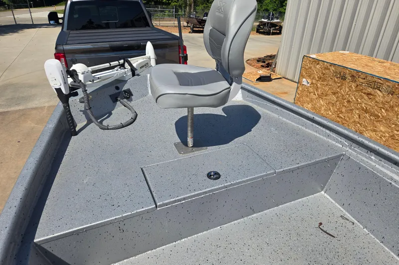 Slide: The Image of 2019 Xpress SW20B boat with a gray seat and trolling motor on a trailer. - 9