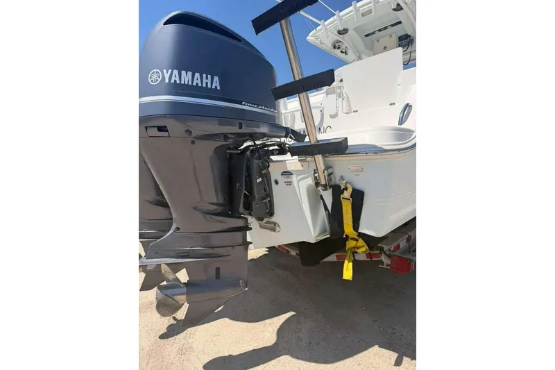 Slide: The Image of 2015 Sea Fox 286 Commander with Yamaha outboard motor, parked on a trailer. - 10