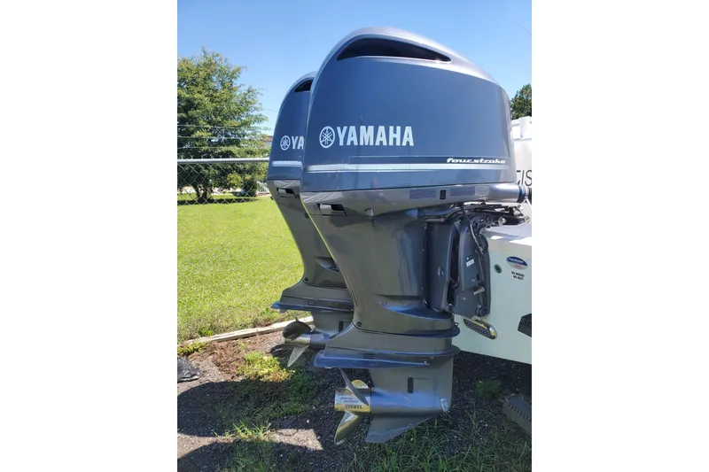Slide: The Image of Twin Yamaha outboard motors on a 2015 Sea Fox 286 Commander boat. - 13