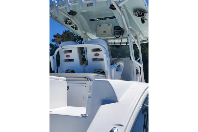 Slide: The Image of 2015 Sea Fox 286 Commander boat interior with seating and canopy. - 15