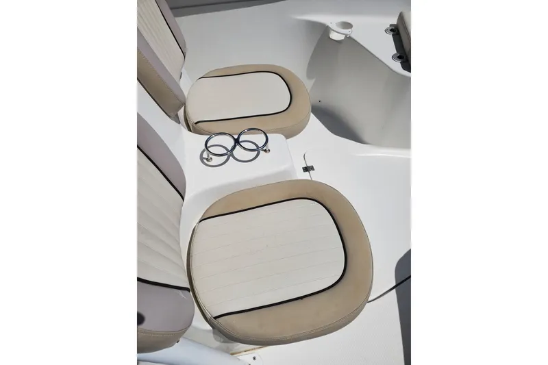 Slide: The Image of Seats and cup holders on a 2015 Sea Fox 286 Commander boat. - 22