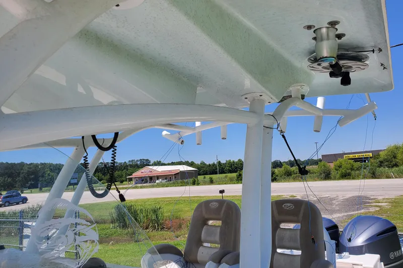 Slide: The Image of 2015 Sea Fox 286 Commander boat interior with fishing rod holders and seating. - 24