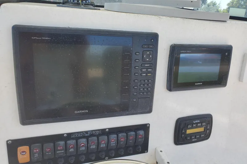 Slide: The Image of Garmin GPS displays on 2015 Sea Fox 286 Commander boat dashboard. - 25