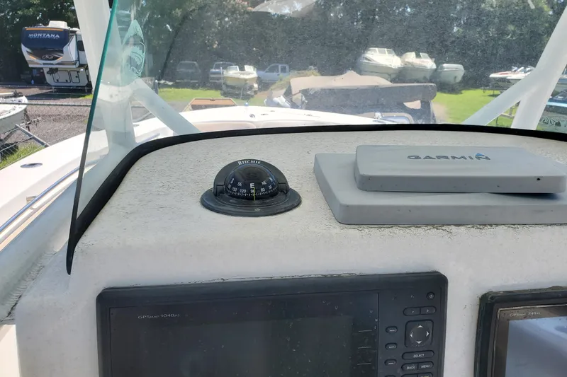 Slide: The Image of Dashboard of a 2015 Sea Fox 286 Commander with Garmin navigation equipment. - 26