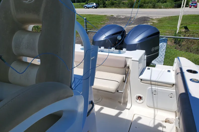 Slide: The Image of 2015 Sea Fox 286 Commander boat with dual Yamaha engines, featuring comfortable seating and storage. - 27