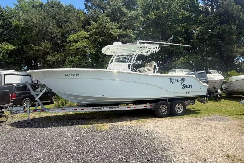 Slide: The Image of 2015 Sea Fox 286 Commander boat on trailer, parked outdoors. - 6