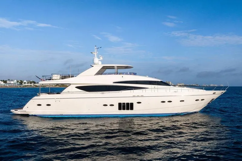 The Image of Luxurious 2010 Princess 95 Motor Yacht cruising on open water under clear skies. - 0