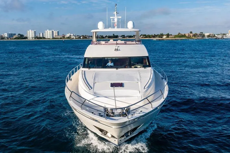 Slide: The Image of Luxury 2010 Princess 95 Motor Yacht cruising on blue ocean near city skyline. - 120