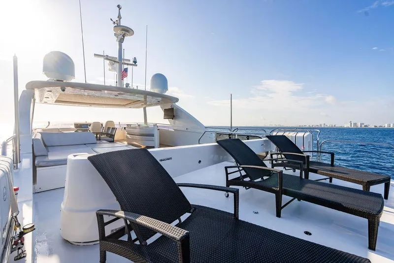 Slide: The Image of Luxurious 2010 Princess 95 Motor Yacht deck with sun loungers, ocean view. - 36