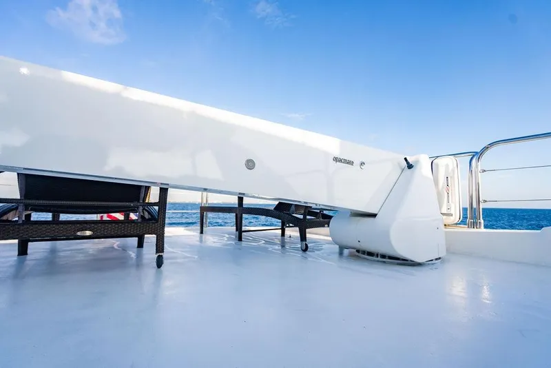 Slide: The Image of Deck view of 2010 Princess 95 Motor Yacht with clear blue sky and ocean backdrop. - 51