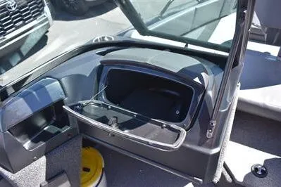 Slide: The Image of 2026 Lowe Fish & Ski 1700 boat interior with open storage compartment. - 25