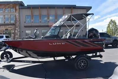 Slide: The Image of 2026 Lowe Fish & Ski 1700 boat parked outdoors, featuring sleek design and modern features. - 4