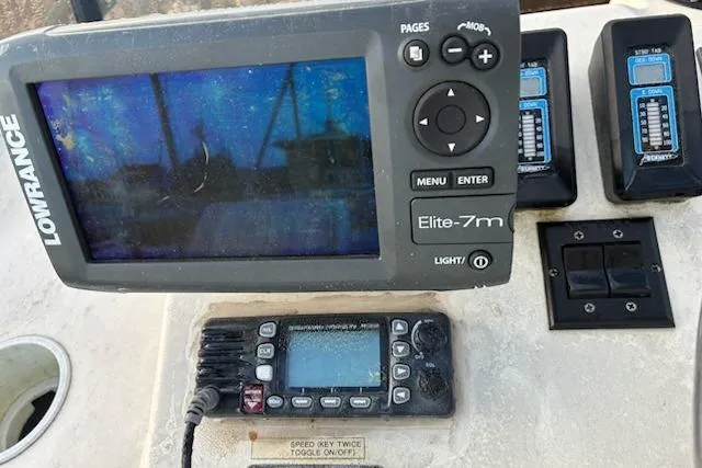 Slide: The Image of Navigation equipment on a 2003 Camano Troll boat, featuring Lowrance Elite-7m display. - 17