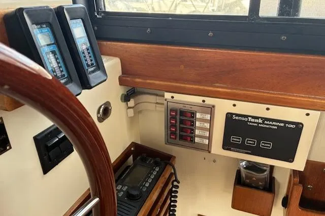 Slide: The Image of 2003 Camano Troll boat dashboard with marine electronics and SensoTank monitor. - 5