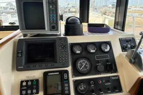 Slide: The Image of Control panel of a 2003 Camano Troll boat with navigation and monitoring equipment. - 6