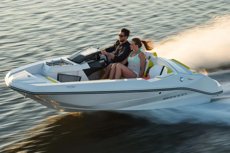 The Image of 2017 Scarab 165 G motorboat on water with two people. - 0