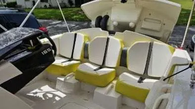 Slide: The Image of Interior of a 2017 Scarab 165 G boat with yellow seats. - 3