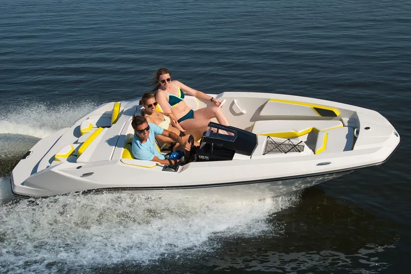 Slide: The Image of 2017 Scarab 165 G boat with three people on the water. - 4