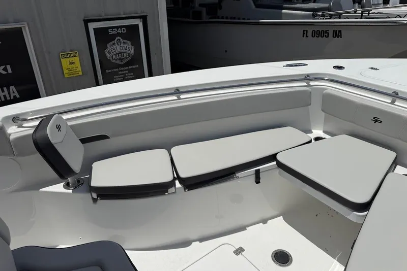 Slide: The Image of 2026 Sea Pro 262 Offshore boat interior with cushioned seating and sleek design. - 11