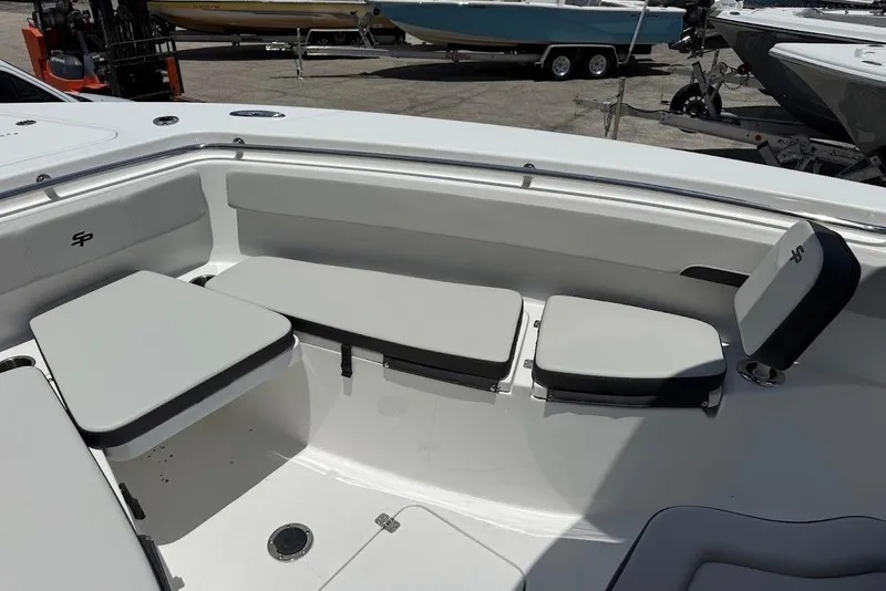 Slide: The Image of 2026 Sea Pro 262 Offshore boat interior with cushioned seating and sleek design. - 14