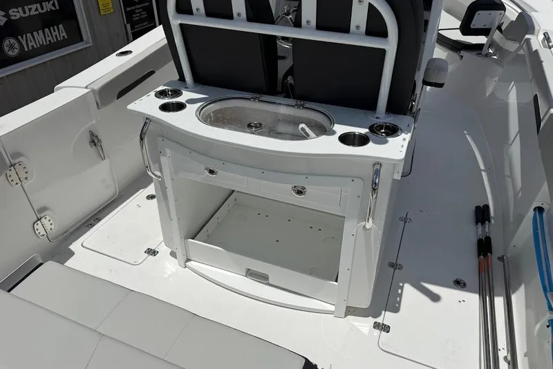 Slide: The Image of 2026 Sea Pro 262 Offshore boat interior with fishing station and storage compartments. - 20