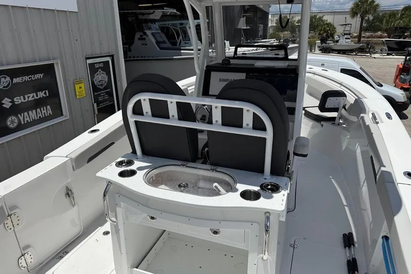 Slide: The Image of 2026 Sea Pro 262 Offshore boat interior with helm, seating, and fishing station. - 21