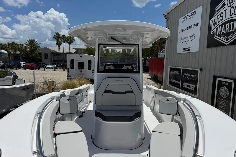 Slide: The Image of 2026 Sea Pro 262 Offshore boat at marina, showcasing spacious seating and modern design. - 3