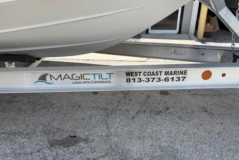 Slide: The Image of Trailer for 2026 Sea Pro 262 Offshore by Magic Tilt, West Coast Marine contact info visible. - 4