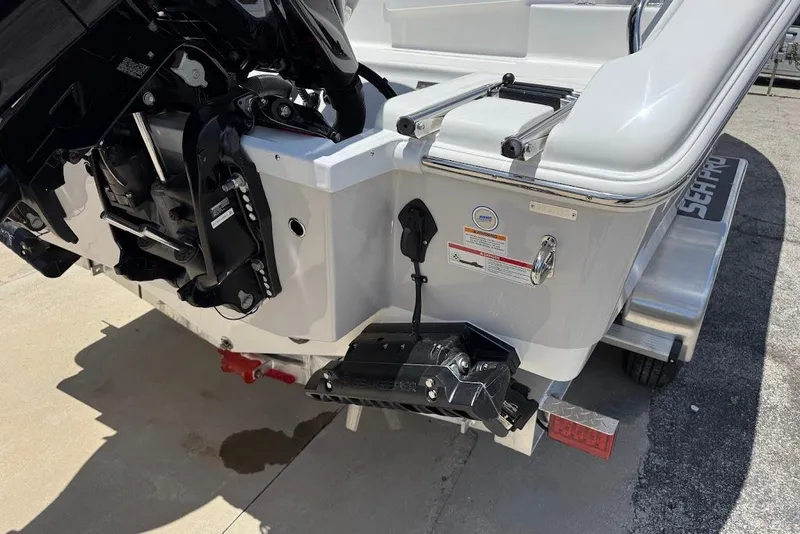 Slide: The Image of 2026 Sea Pro 262 Offshore boat stern with motor and ladder on trailer. - 8