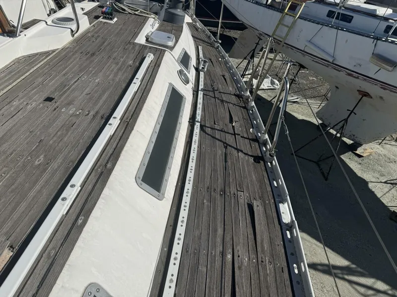Slide: The Image of Deck of a 1987 Wauquiez Centurion 47 sailboat in the shipyard. - 10