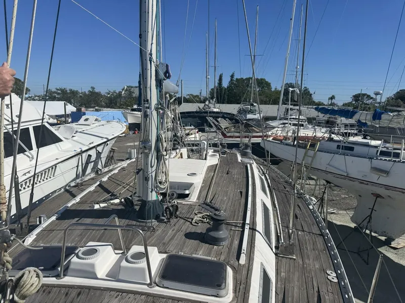 Slide: The Image of 1987 Wauquiez Centurion 47 sailboat docked in harbor. - 14