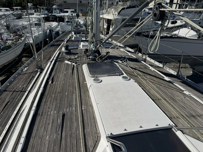 Slide: The Image of Deck of a 1987 Wauquiez Centurion 47 sailboat in harbor. - 21