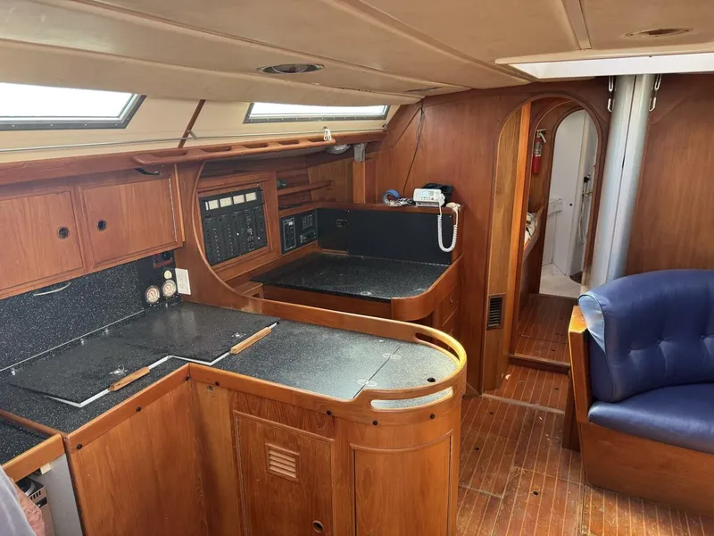 Slide: The Image of Interior of a 1987 Wauquiez Centurion 47 yacht with wooden furnishings. - 25