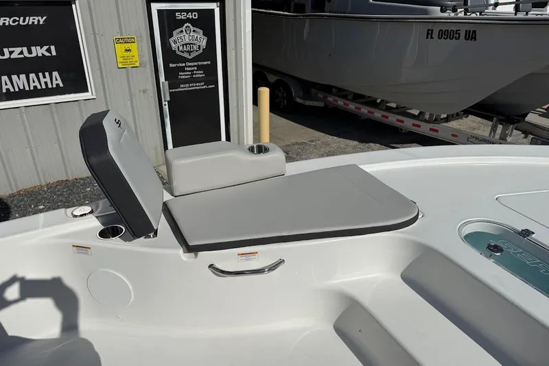 Slide: The Image of 2026 Sea Pro 250 Bay boat interior with seating and storage, displayed at West Coast Marine. - 11