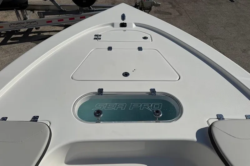 Slide: The Image of Bow view of 2026 Sea Pro 250 Bay boat with storage compartments. - 13