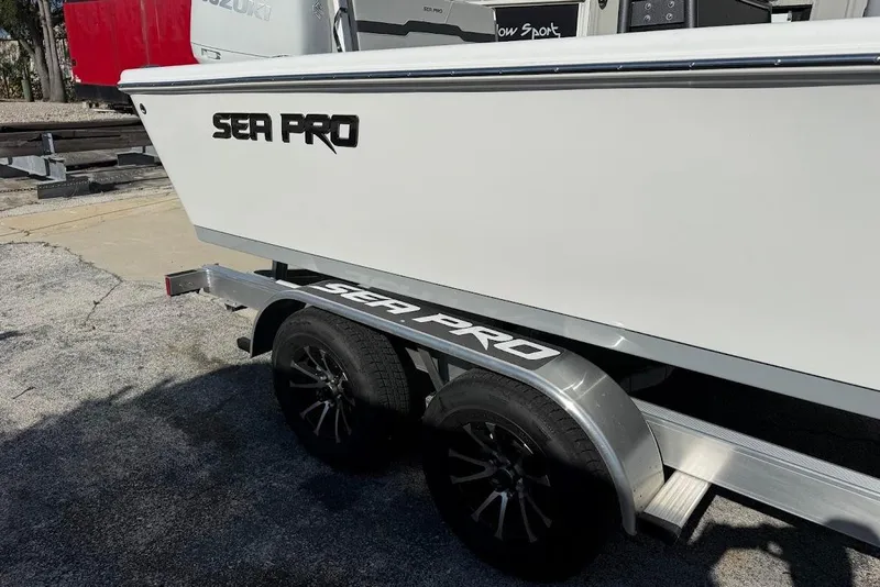 Slide: The Image of 2026 Sea Pro 250 Bay boat on trailer, featuring sleek design and branding. - 3