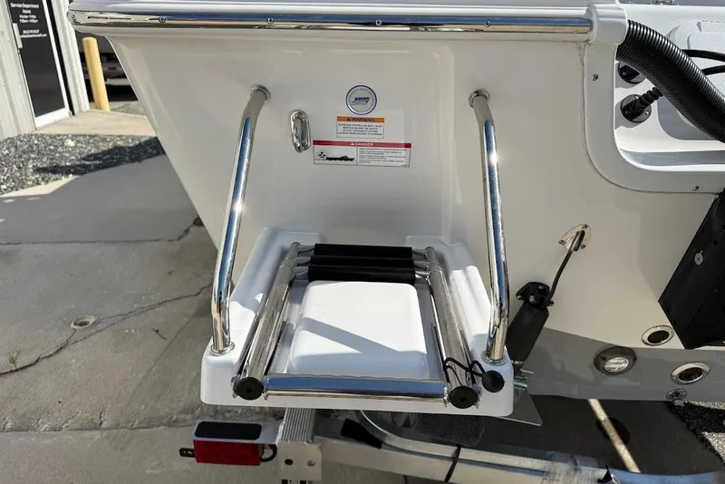 Slide: The Image of 2026 Sea Pro 250 Bay boat ladder and stern view, showcasing stainless steel details. - 9