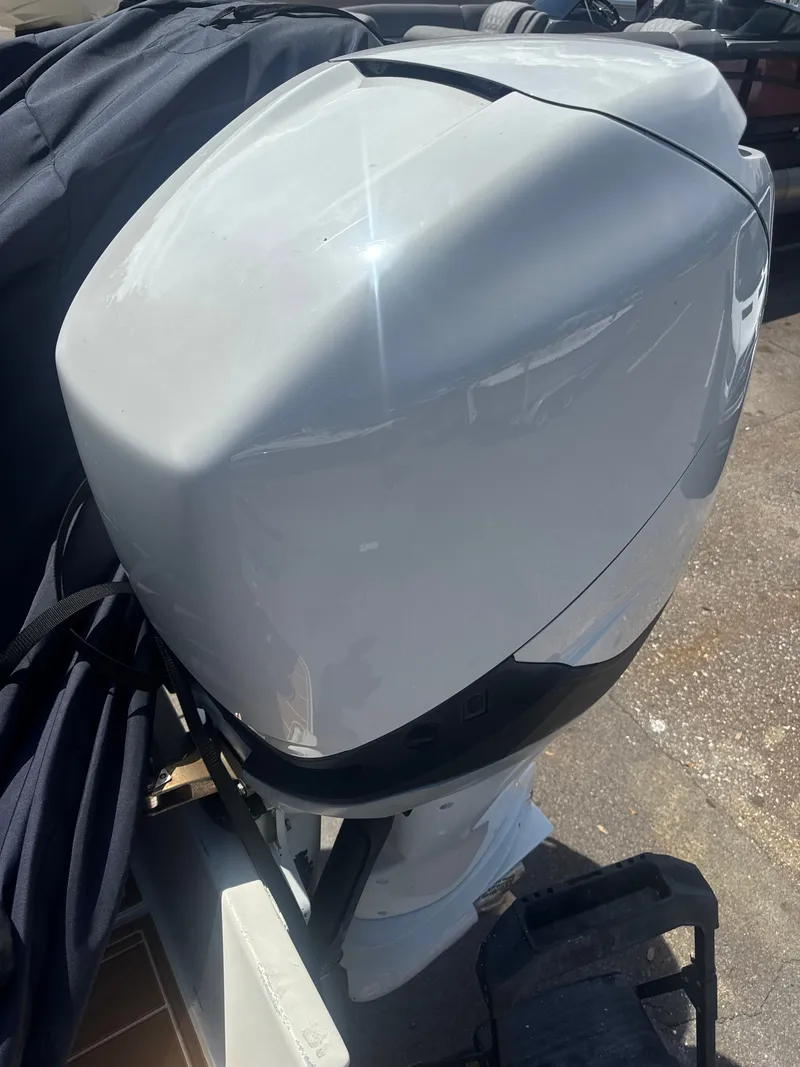Slide: The Image of Outboard motor of a 2006 Jupiter 31 CC FWD Seating boat. - 13