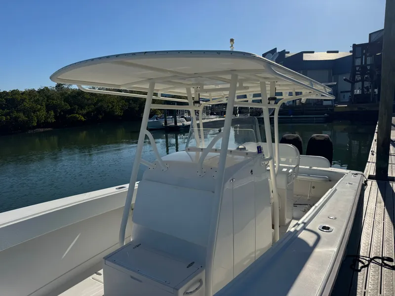 Slide: The Image of 2006 Jupiter 31 CC FWD boat docked on a sunny day. - 15