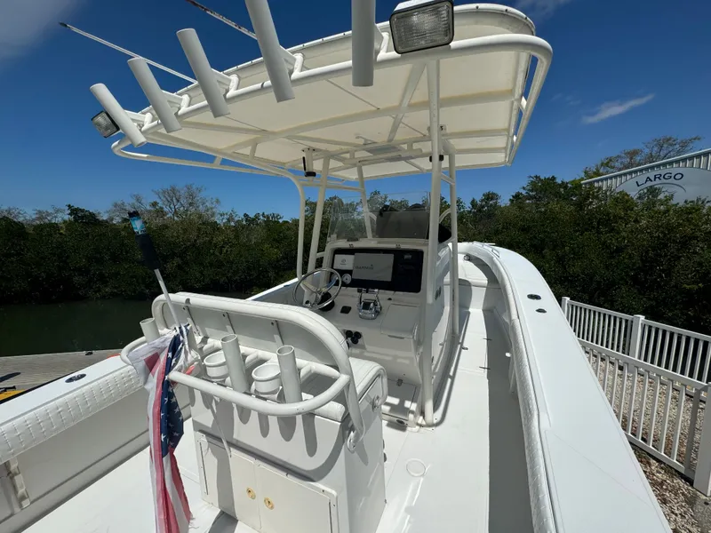 Slide: The Image of 2006 Jupiter 31 CC boat with helm and fishing rod holders. - 28