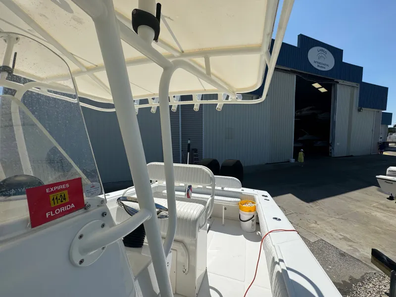 Slide: The Image of 2006 Jupiter 31 CC boat at a marina entrance. - 32