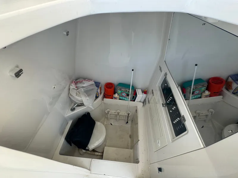 Slide: The Image of Interior of a 2006 Jupiter 31 CC FWD boat with storage area. - 38