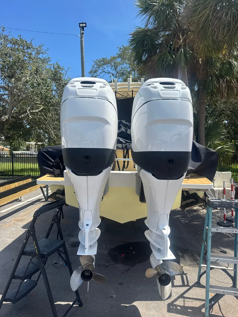 Slide: The Image of 2006 Jupiter 31 CC boat with dual outboard engines. - 9