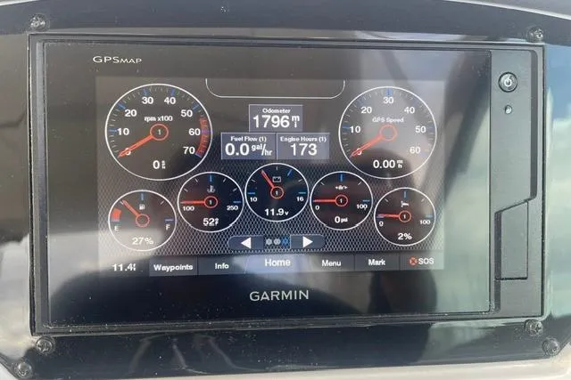 Slide: The Image of Garmin GPS display on 2020 Regal 28 Express showing odometer, fuel flow, and engine hours. - 10