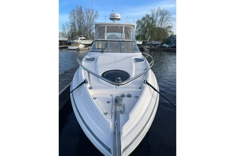 Slide: The Image of 2020 Regal 28 Express boat docked, featuring sleek design and modern amenities. - 2