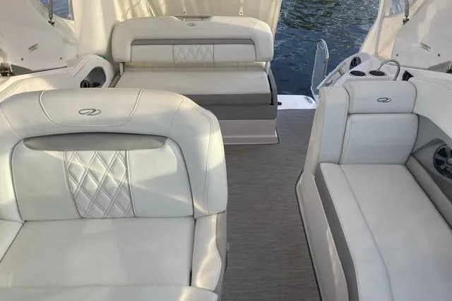 Slide: The Image of Luxurious interior of 2020 Regal 28 Express boat with plush seating and elegant design. - 5