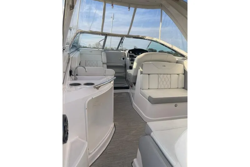 Slide: The Image of 2020 Regal 28 Express boat interior with white seating and modern design. - 7